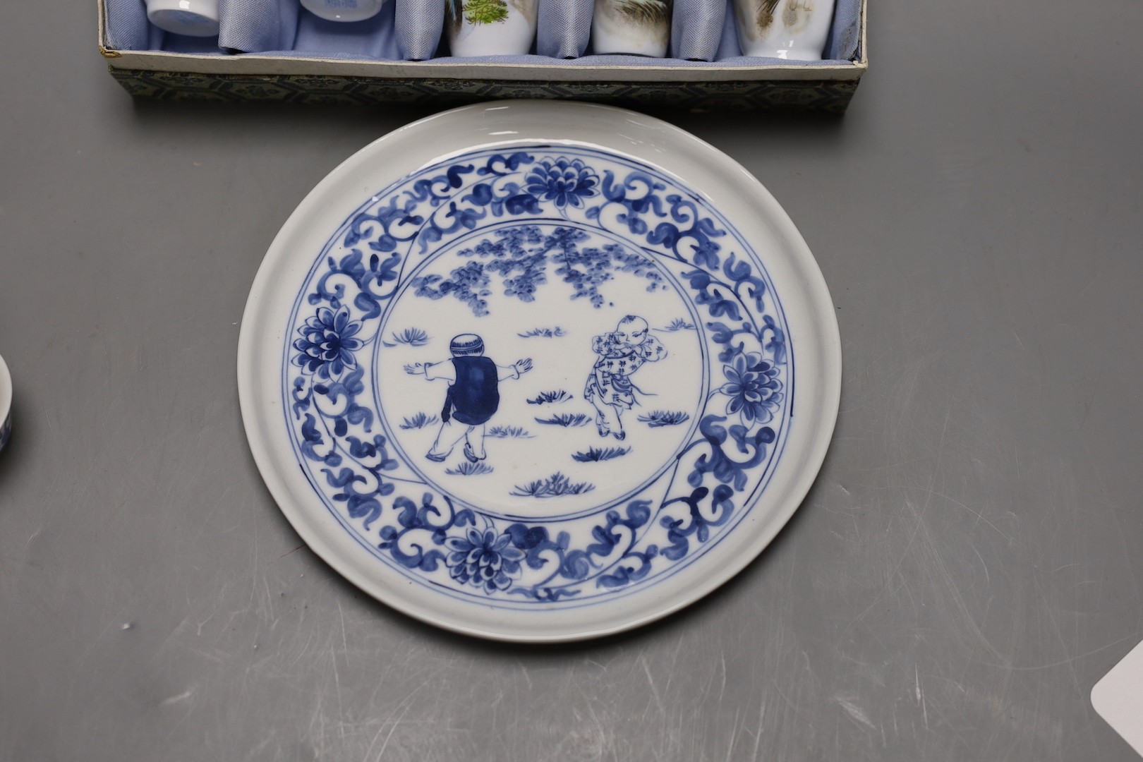 A Chinese blue and white miniature teapot, 6 matching cups and a tray and a box of five vases